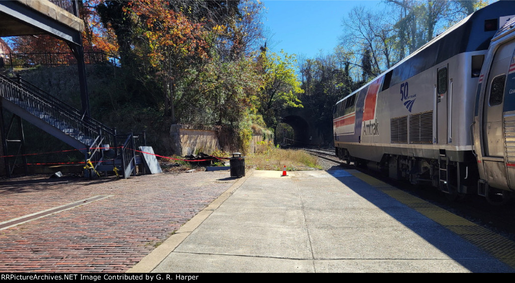 Going away shot of Pepsi can heritage unit 160 on train 151.  New stairs being constructed to the left.